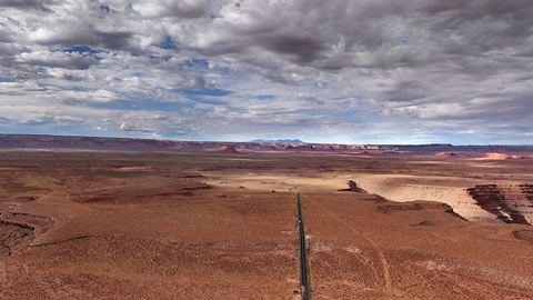 Layered desert cliffs under clouds — Stillmotion