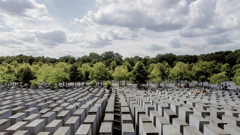 Concrete memorial field under cloudy sky — Stillmotion