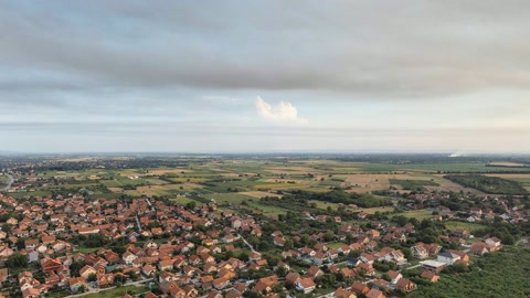 Village and industrial smoke under clouds — Stillmotion
