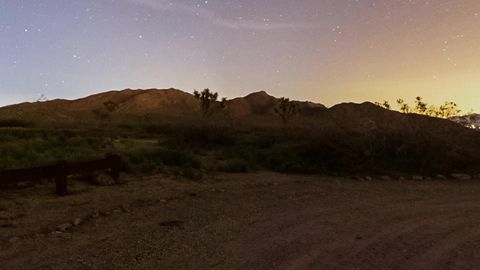 Night desert road with trucks — Stillmotion