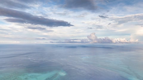 Cloudy ocean with distant reef waters — Stillmotion