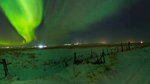 Aurora over snowy rural fields — Stillmotion