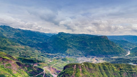 Green mountain valley with cable bridge — Stillmotion
