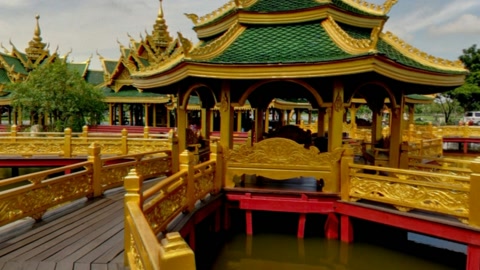 Golden temple complex by water — Stillmotion