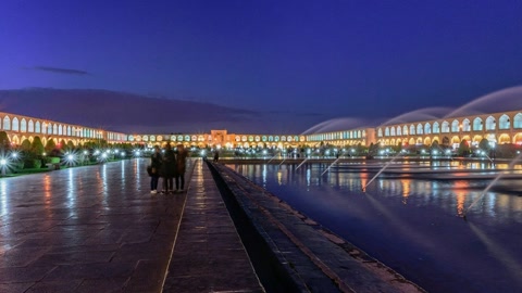 Illuminated promenade by reflecting pool — Stillmotion