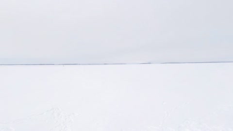 Snowfield with rescue boat and swimmers — Stillmotion