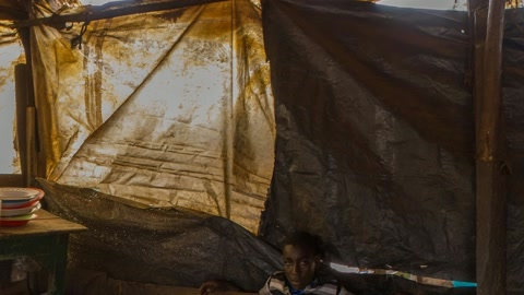 Makeshift shelter with cooking area — Stillmotion
