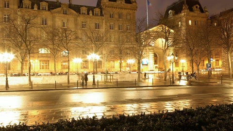 Night plaza with illuminated buildings — Stillmotion
