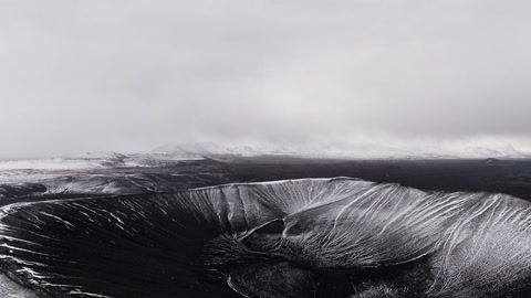 Snow-dusted volcanic landscape — Stillmotion
