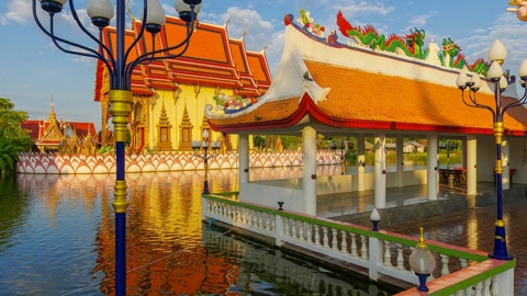Temple complex beside calm canal — Stillmotion