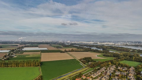 Aerial view of river and farmland — Stillmotion