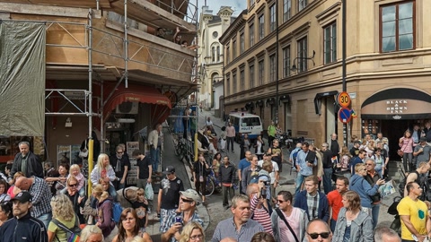 Crowded street parade near outdoor stage — Stillmotion