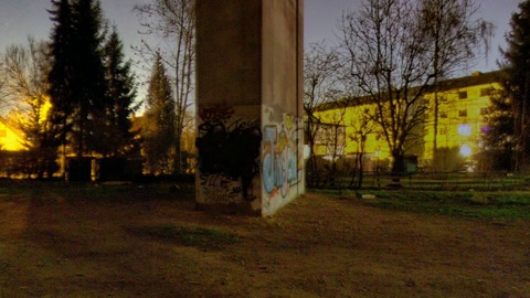 Underpass with apartment buildings at night — Stillmotion