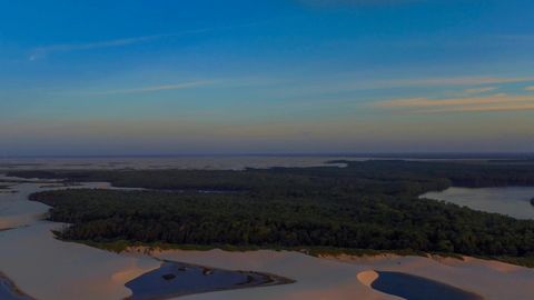 Sand dunes and waterways at sunset — Stillmotion