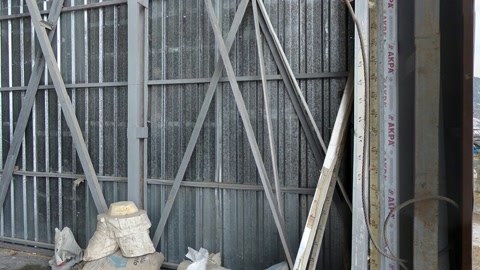 Construction site with giant sculpted head — Stillmotion