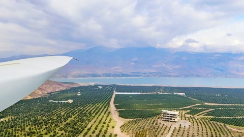 Vineyard wind turbines and mountains — Stillmotion