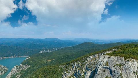 Forest cliffs above winding river — Stillmotion