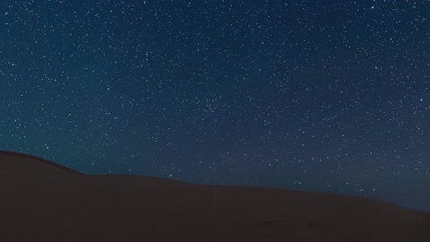 Starry night over desert dunes — Stillmotion