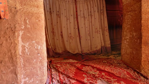 Rock-cut chamber with painted walls — Stillmotion