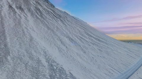 Snow-covered slopes at sunset — Stillmotion