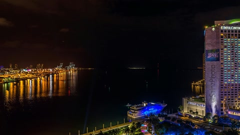 Waterfront downtown skyline at night — Stillmotion