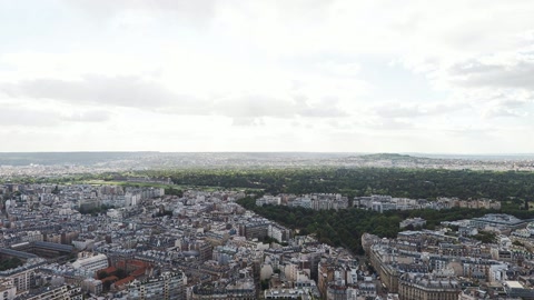 Aerial view over dense cityscape — Stillmotion