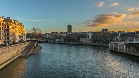 River promenade with historic riverside buildings — Stillmotion