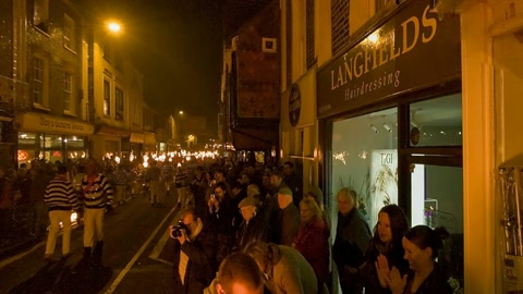 Night crowd around fire torches — Stillmotion