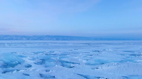 Frozen ice shelf with rocky outcrops — Stillmotion