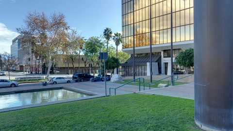Urban plaza with lawns and water feature — Stillmotion