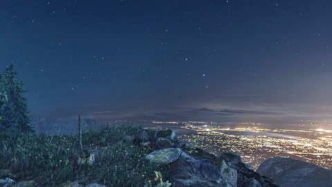 Night mountain vista with city lights — Stillmotion