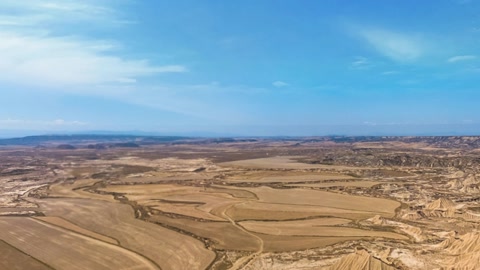 Badlands desert cliffs and farmland — Stillmotion