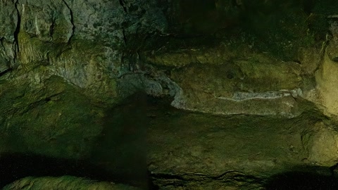 Glowing grotto rocks in darkness — Stillmotion