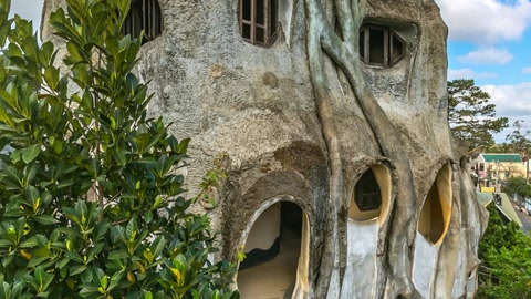 Whimsical sculpted village with lush gardens — Stillmotion