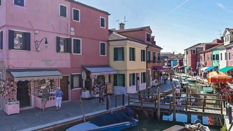 Colorful canal-side town street — Stillmotion