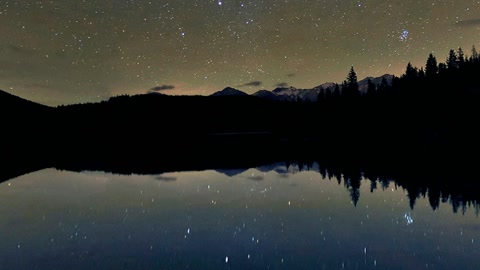 Starry lake with wooden dock — Stillmotion