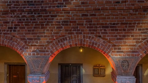 Brick courtyard with arched colonnade — Stillmotion