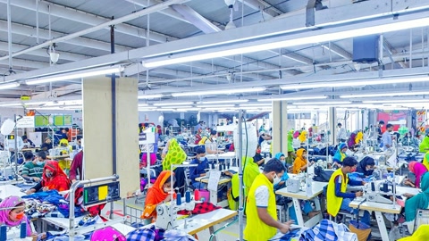 Busy garment factory interior — Stillmotion