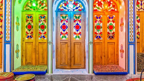 Ornate room with colorful arched doors — Stillmotion