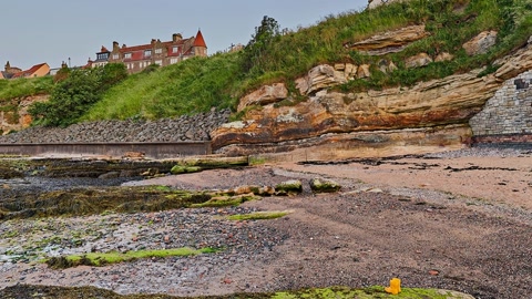 Rocky cliff above tidal pool — Stillmotion
