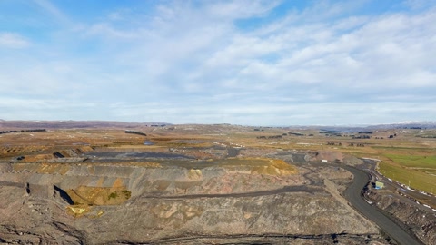 Open pit mine in arid landscape — Stillmotion