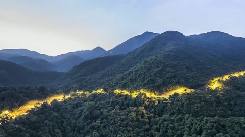 Mountain lake with illuminated shoreline — Stillmotion