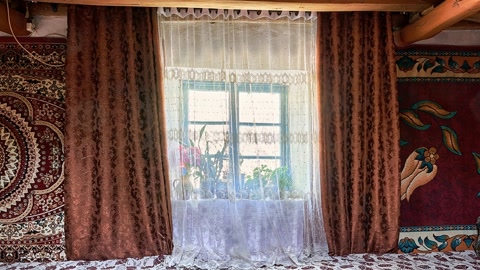 Traditional bedroom with ornate textiles — Stillmotion