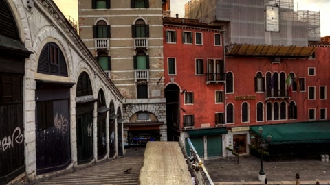 Canal city street with arched bridge — Stillmotion