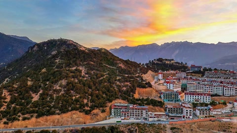 Village overlooking mountain valley — Stillmotion