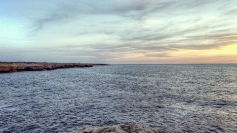 Rocky sea cliffs at dusk — Stillmotion