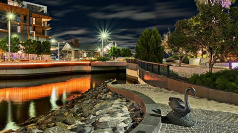 Night canal urban skyline reflections — Stillmotion