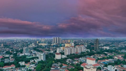 Skyscrapers over city at sunset — Stillmotion