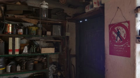 Cluttered storage room with shelves and tools — Stillmotion