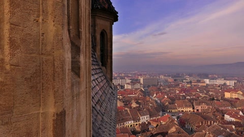 Aerial view over village rooftops — Stillmotion